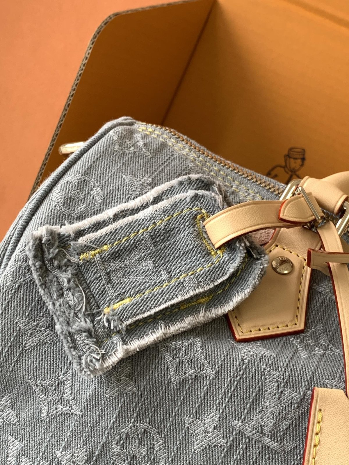 Louis Vuitton Speedy Soft 30 in grey Monogram denim — exterior pocket detail