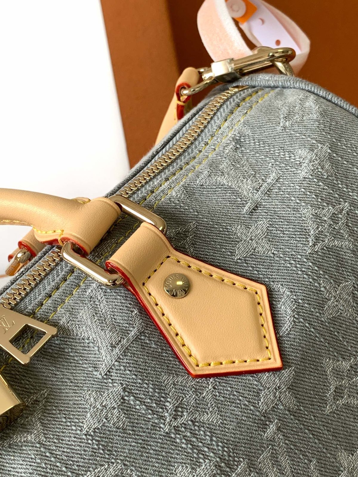 Louis Vuitton Speedy Soft 30 in grey Monogram denim — handle mounting detail
