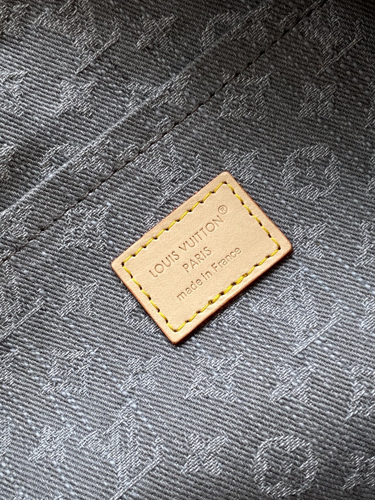 Louis Vuitton Speedy Soft 30 in grey Monogram denim — interior label detail
